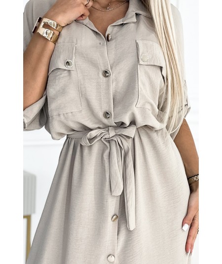 Beżowa sukienka typu Szmizjerka midi ze złotymi guzikami i wiązaniem